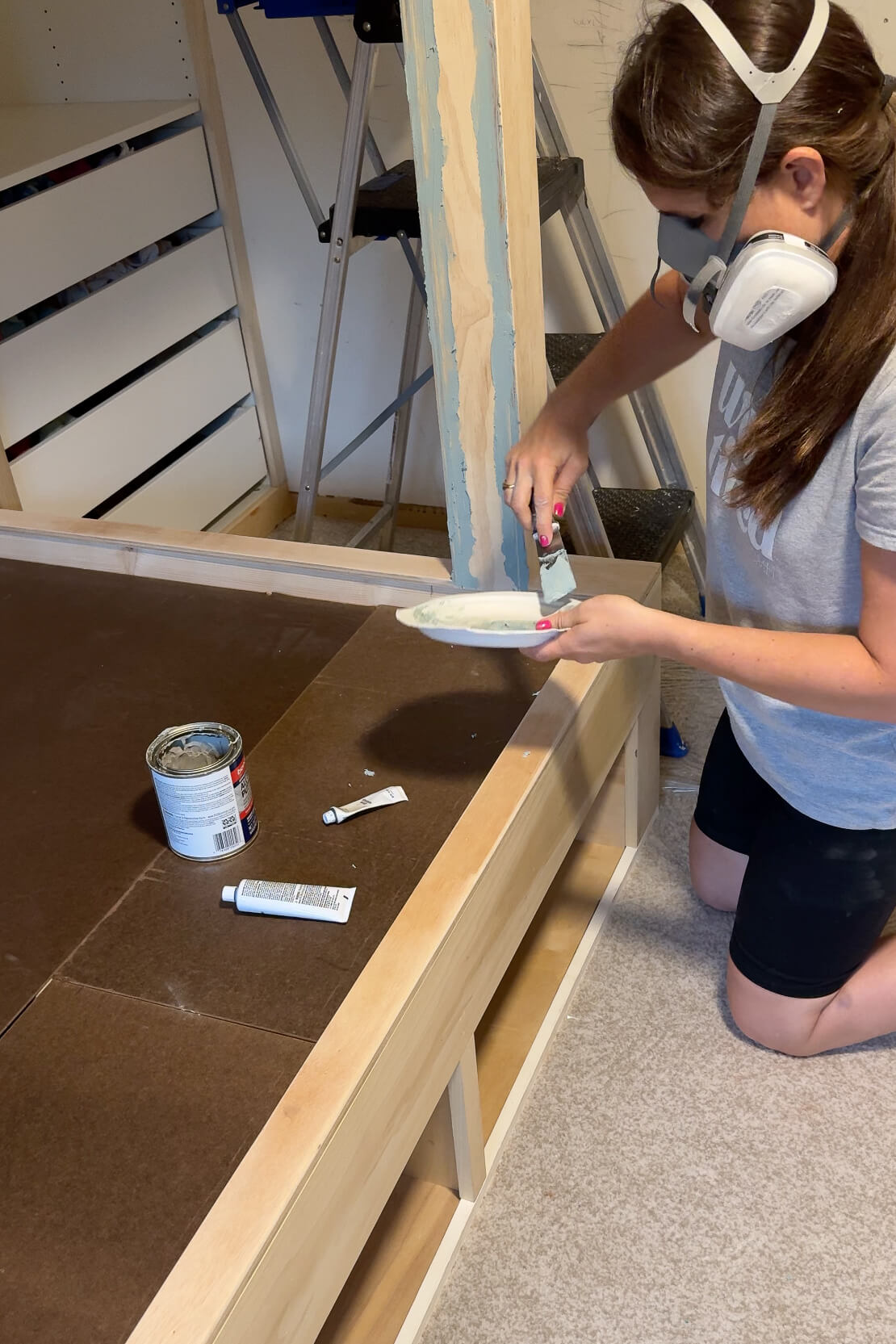 Using bondo to fill seams on my DIY bunk beds.